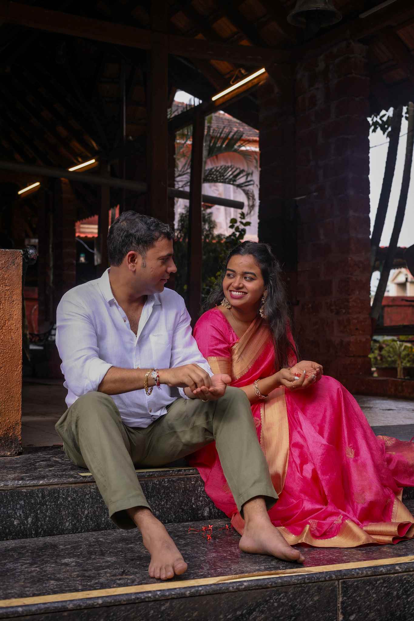 Candid couple sitting together traditional attire