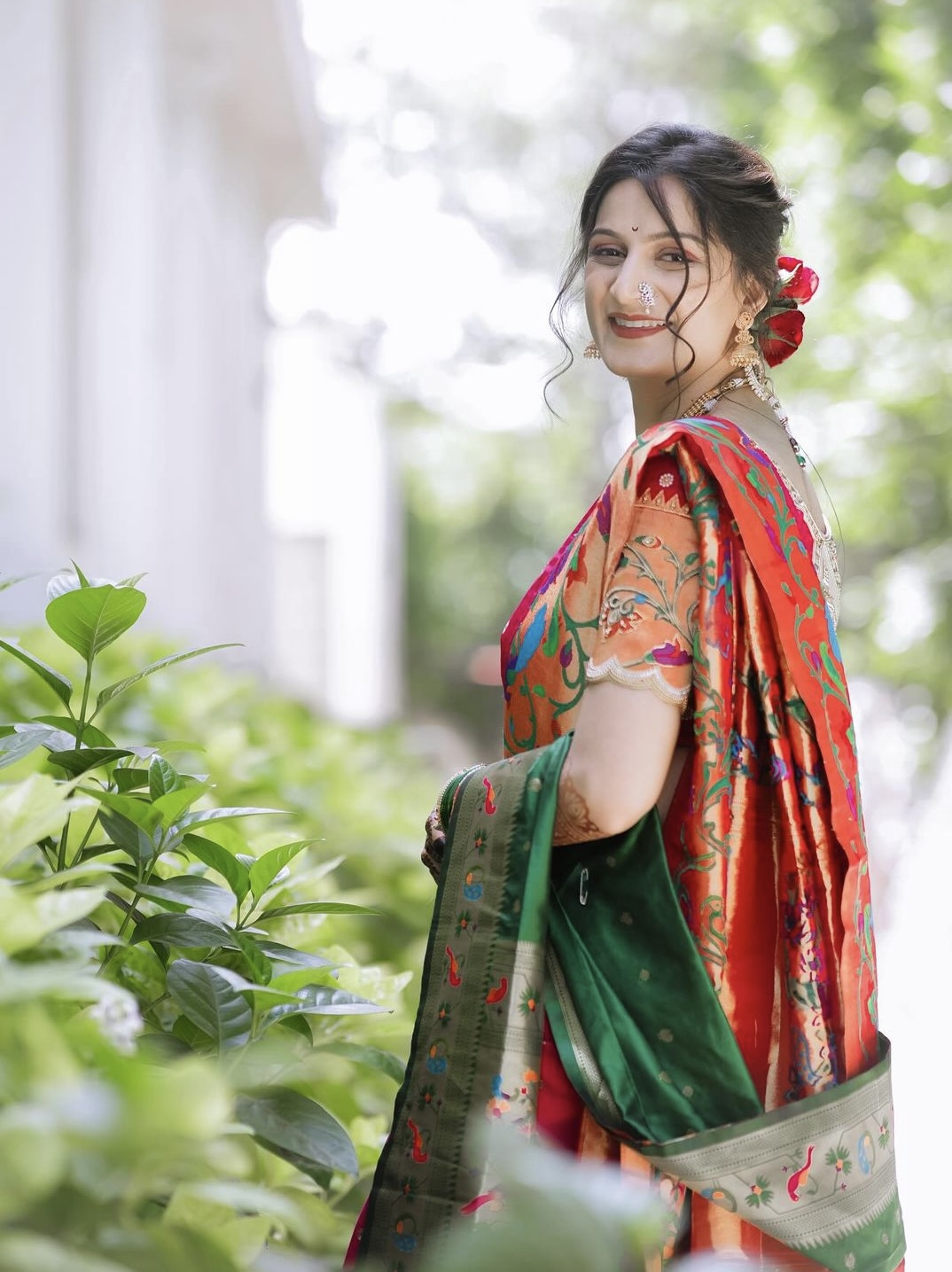 Candid bridal portrait in traditional green saree